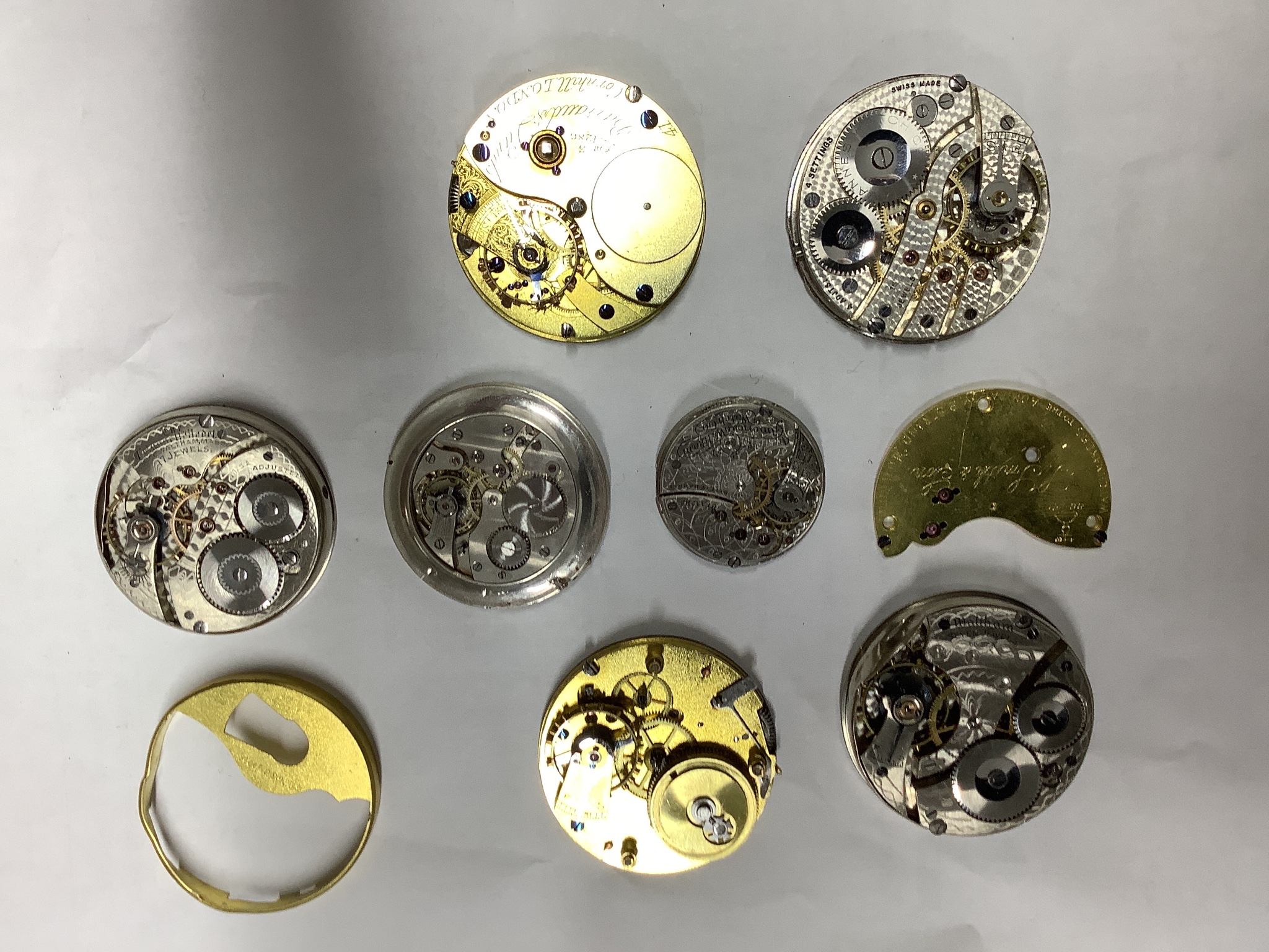 A small collection of assorted pocket watch movements, including Waltham & Tavannes.